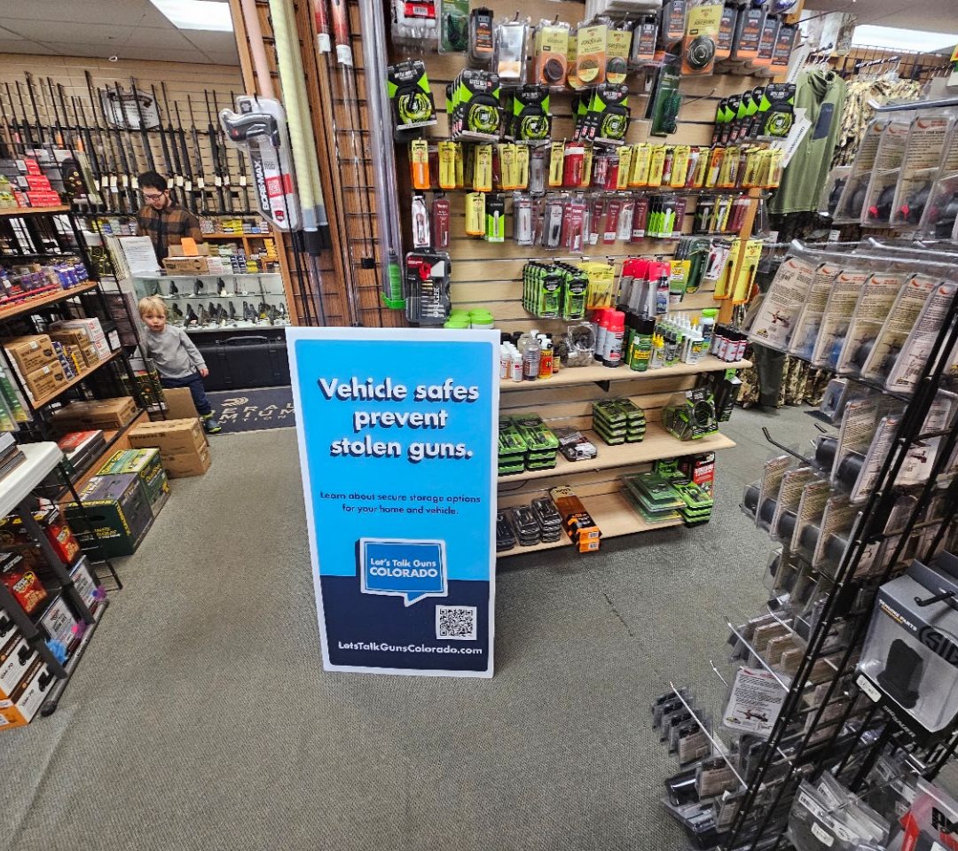 16516797-201 W Tomichi Ave-Gunnison-CO_1080x960 An out-of-home advertisement for Let's Talk Guns Colorado in a gun shop in Gunnison, Colorado.